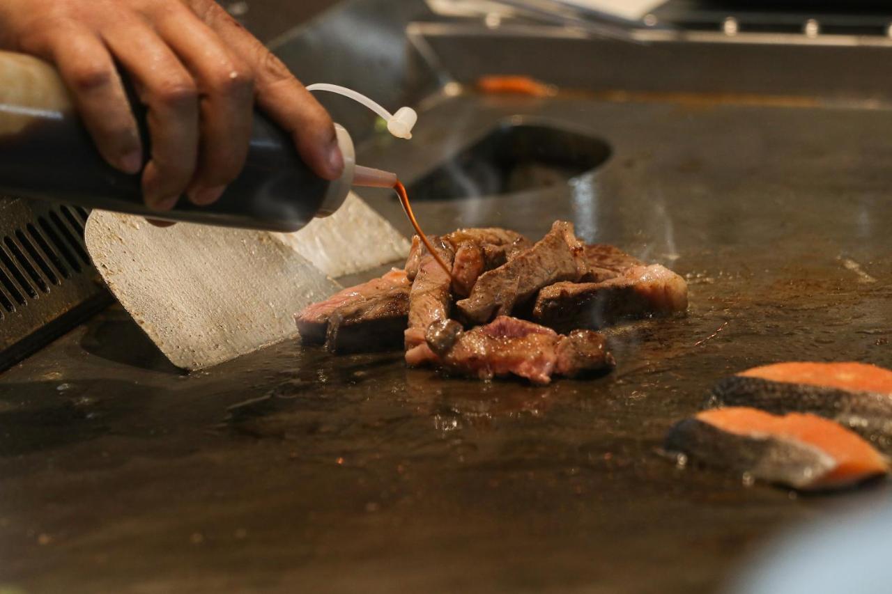 Chatrium Grand Bangkok Exteriör bild Soy sauce being used in cooking