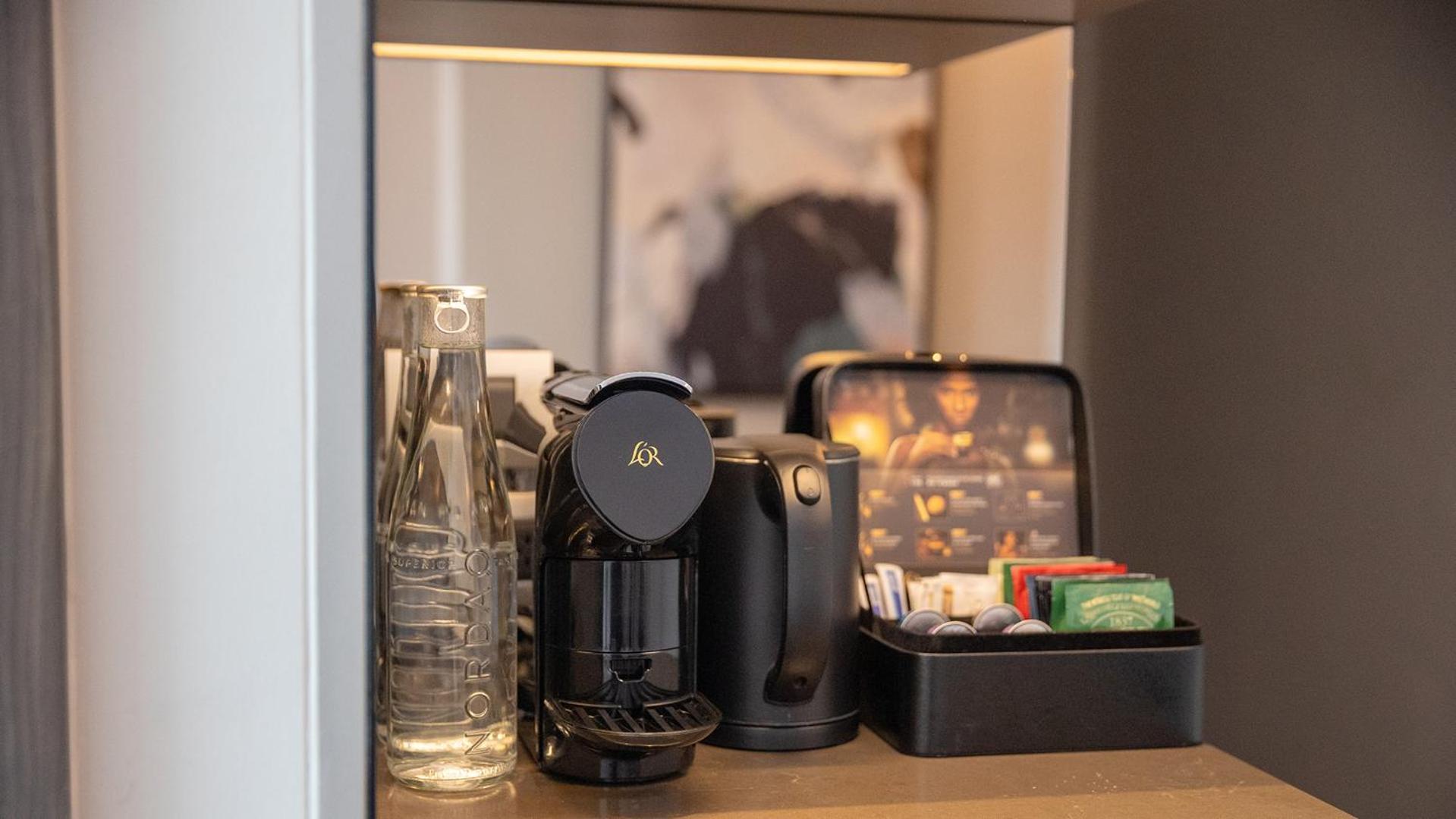 Chatrium Grand Bangkok Exteriör bild A Nespresso coffee machine in a hotel room